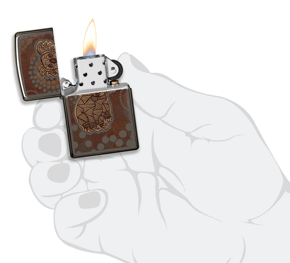 Zippo lighter front view Black Ice® opened and lit with coloured image of a koala in the style of Aboriginal art in stylised hand