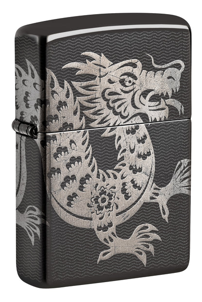 A black Zippo lighter featuring a detailed silver dragon design P1