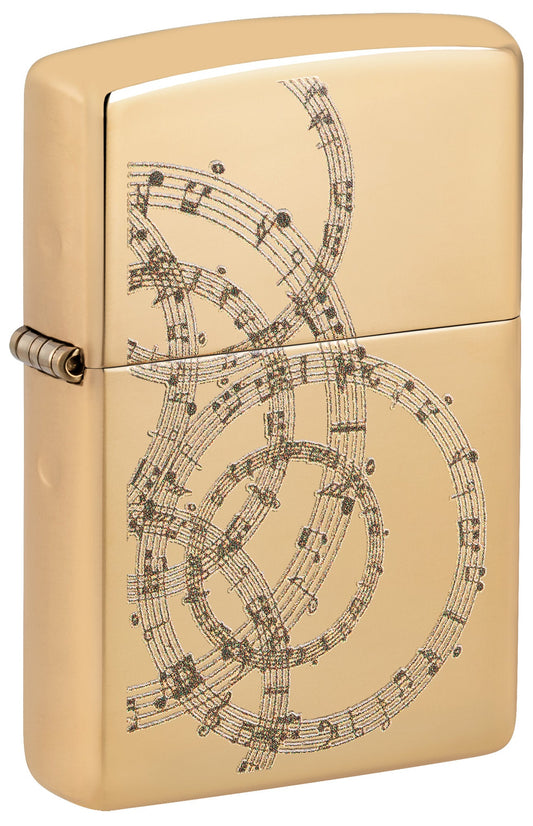 Gold Zippo lighter with intricate music sheet design P1