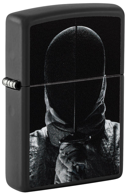 Black Zippo lighter with a design of a person wearing a hooded garment on a black background P1