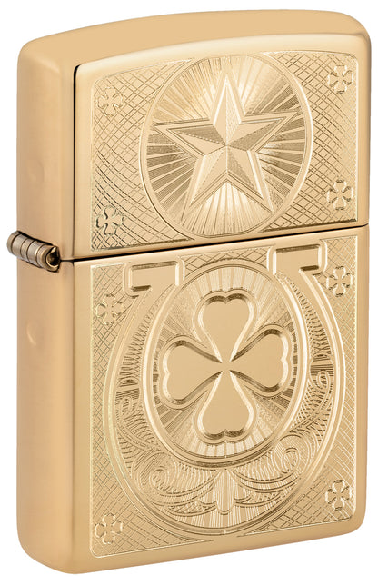 A gold Zippo lighter with a star and a clover motif P1