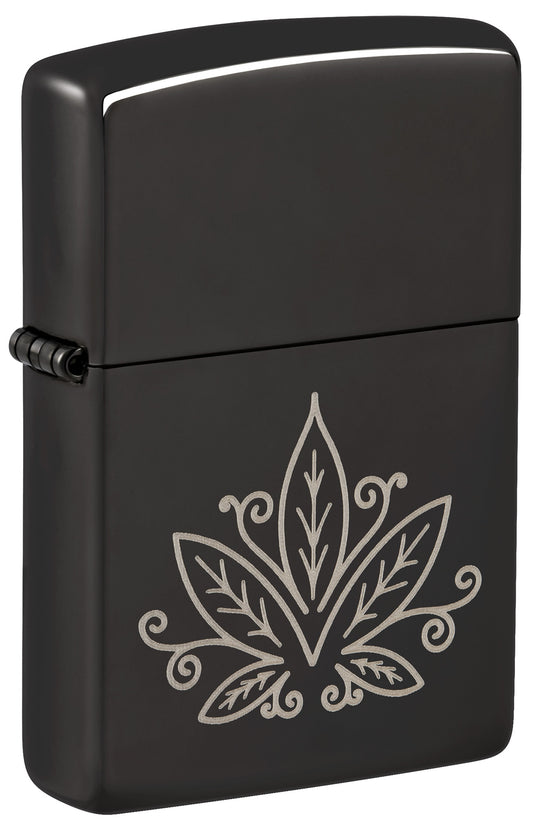 A matte black Zippo lighter with a silver engraved cannabis leaf design P1