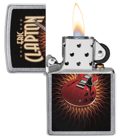 Zippo lighter front view chrome open and lit with coloured image of a red guitar by Eric Clapton