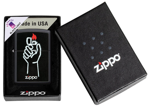 Zippo lighter front view black matt opened and lit with image of Zippo lighter in one hand and Zippo logo in open box with black light note