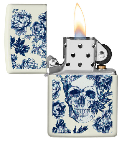 Zippo Lighter Glows in the Dark Skull with Crown Surrounded by Blue Flowers Open with Flame