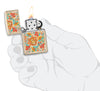 Zippo lighter colour print sand with floral hippie style open with flame in stylised hand