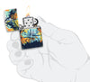 Zippo lighter 540 degree design with signpost in the colourful night sky of nature opened with flame in stylised hand