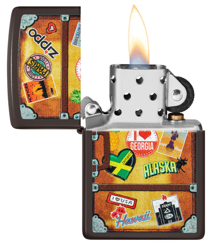 Zippo Lighter Front View brown representing a suitcase with a different city stickers stuck on it such as Paris, Hawaii, Barcelona, New York opened and Lit