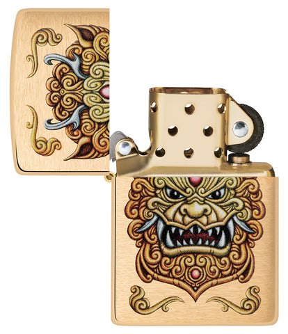 Front view of the open Zippo windproof lighter Foo Dog Design, without flame, showing an imperial golden lions in the style of chinese art.